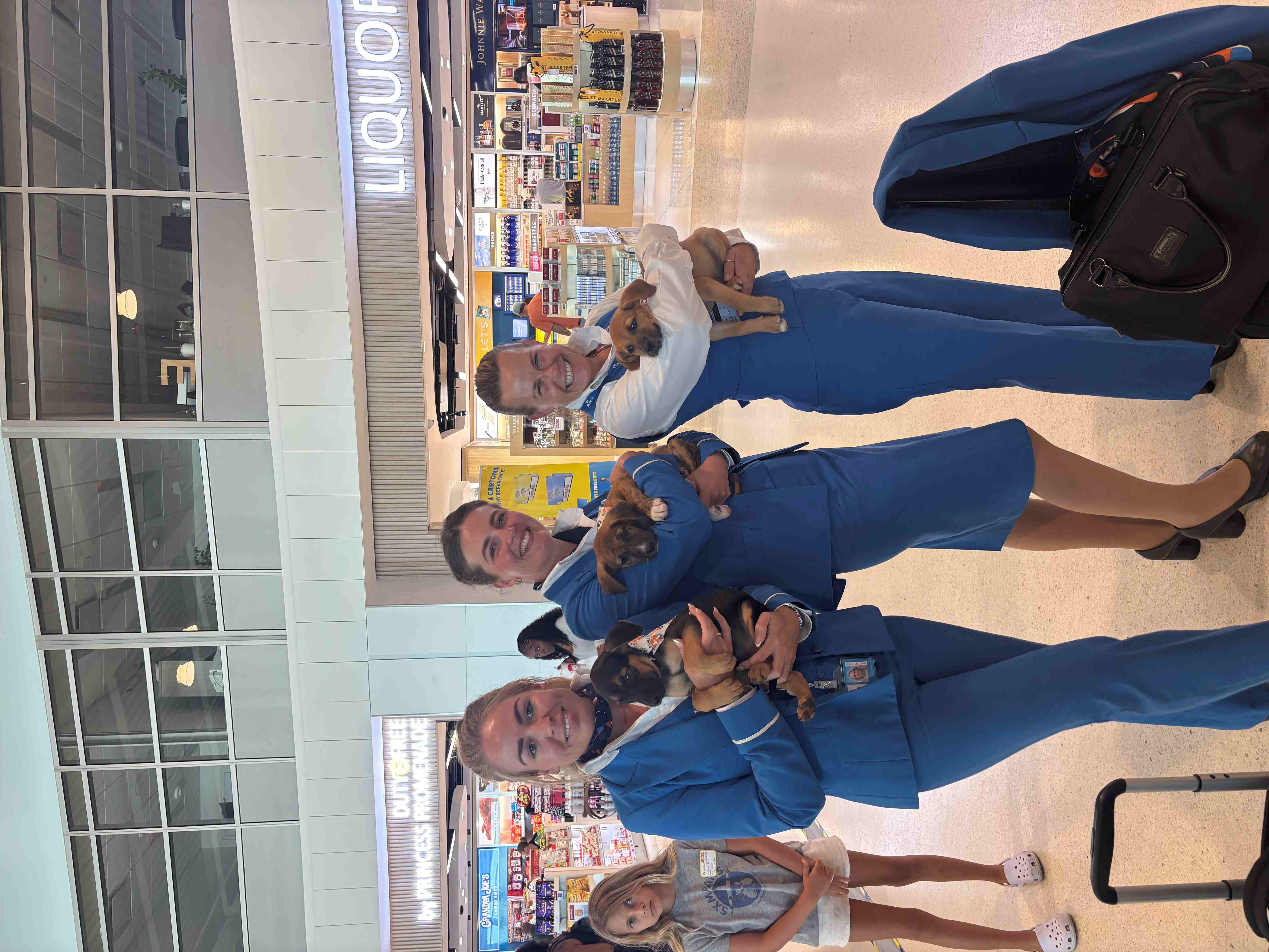 SXM AIRPT PAWS three klm crew members